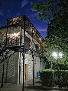a building with a balcony on the side of it at Balneario de Ledesma in Vega de Tirados