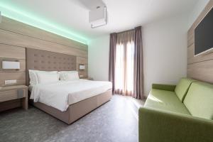 Postel nebo postele na pokoji v ubytování HOTEL TRILAGO