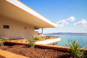 a house with a view of the water at Residence Sole Dell'Argentario in Porto Santo Stefano