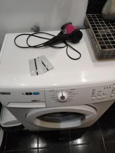 een wasmachine met een controller erop bij Studio apartments in center NEW 5 floor in Ivano-Frankivsʼk