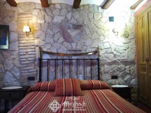 A bed or beds in a room at Hotel Apartamentos Melihah