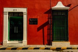 
a red brick building with a red door at H177 Hotel in Campeche
