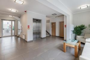 Hol lub recepcja w obiekcie Apartamenty Casa Marina