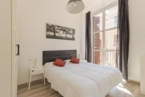 Posteľ alebo postele v izbe v ubytovaní Beautiful flat with balcony and wifi in Málaga Center