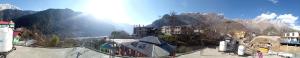 a view of a town on a mountain with buildings at Mahima in Sāngla