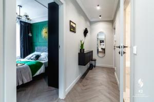 Łóżko lub łóżka w pokoju w obiekcie Apartamenty Flat White Obywatelska 49