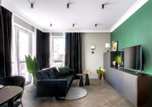 Telewizja i/lub zestaw kina domowego w obiekcie Apartamenty Flat White Obywatelska 49