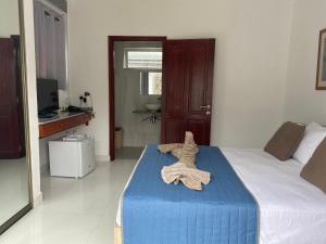 Postel nebo postele na pokoji v ubytování Hotel Plein Soleil