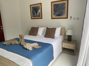 Postel nebo postele na pokoji v ubytování Hotel Plein Soleil
