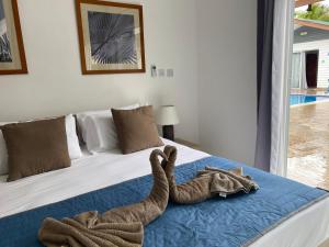 Postel nebo postele na pokoji v ubytování Hotel Plein Soleil