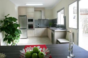 A kitchen or kitchenette at Sa Posada