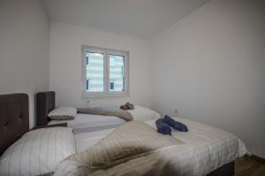 Ένα ή περισσότερα κρεβάτια σε δωμάτιο στο Sarajevo Dream Apartment