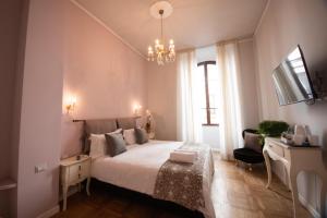 Posteľ alebo postele v izbe v ubytovaní B&B Dimora Sassetti 6