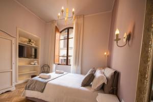 Posteľ alebo postele v izbe v ubytovaní B&B Dimora Sassetti 6