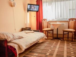 Postel nebo postele na pokoji v ubytování Zajazd Zacisze + 37 fotografií