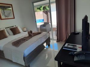 TV a/nebo společenská místnost v ubytování Hotel Plein Soleil