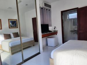 Postel nebo postele na pokoji v ubytování Hotel Plein Soleil