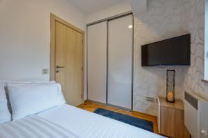 Postel nebo postele na pokoji v ubytování Centar M LUX Zlatibor