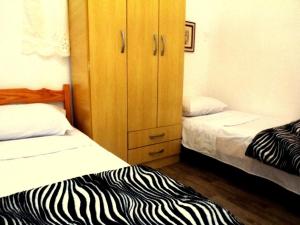 Llit o llits en una habitació de Pousada Polônia