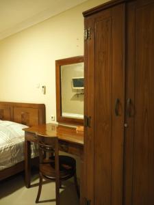 Postel nebo postele na pokoji v ubytování Rhiz Guest House Tebet