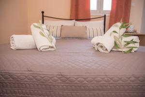 Postel nebo postele na pokoji v ubytování Ktima Develekou