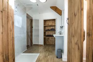 a bathroom with a white tub and a sink at Ashgrove Farm - 1 Bedroom Apartment - Llawhaden - Narberth in Narberth +29 photos