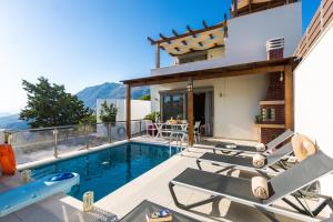 a villa with a swimming pool and a house at Villa Saktouris in Saktoúria