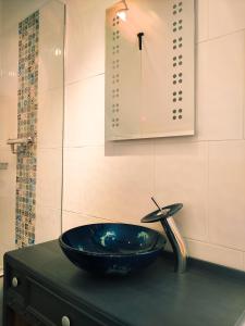 a bathroom with a blue bowl sink on a counter at White Horse Inn in Chester