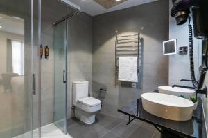 Koupelna v ubytování Aquitania Home Suites