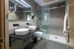 Koupelna v ubytování Aquitania Home Suites