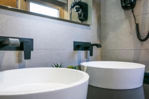 Koupelna v ubytování Aquitania Home Suites