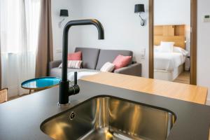 Posezení v ubytování Aquitania Home Suites
