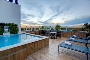 a pool on the roof of a building at Advanced Hotel & Flats Cuiabá in Cuiabá