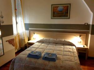 Voodi või voodid majutusasutuse Albergo Astro toas