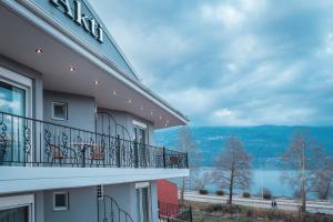 a balcony of a building with a view of the water at Akti Hotel Ioannina in Ioannina