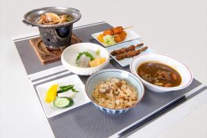 a tray with different dishes of food on it at Tabist Daibou Ichihara Mens Only in Ichihara