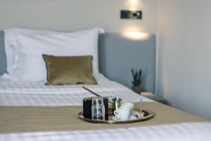 Postel nebo postele na pokoji v ubytování Akti Hotel Ioannina