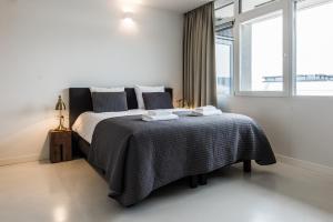 Postel nebo postele na pokoji v ubytování Houthavens Apartments