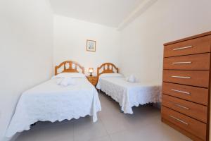 Posteľ alebo postele v izbe v ubytovaní Apartamentos Nuevo México C 131