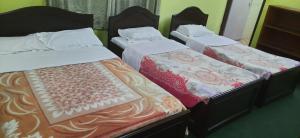 Кровать или кровати в номере New Pokhara Lodge - Lakeside, Pokhara Nepal