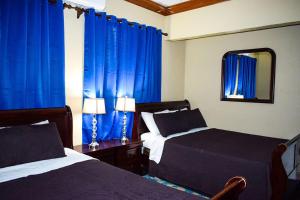 Ένα ή περισσότερα κρεβάτια σε δωμάτιο στο Brownstone Guesthouses +48 φωτογραφίες