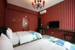 Uma cama ou camas num quarto em Fun Trip - Little Castle & Oscar B&B