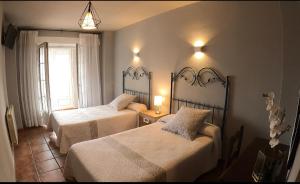 Postel nebo postele na pokoji v ubytování Hostal Santiago