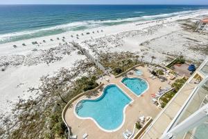 an overhead view of a beach and two pools at Emerald Isle in Pensacola Beach
