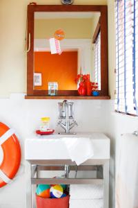 a bathroom with a sink and a mirror at Hotel Del Sol in San Francisco