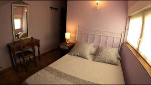 Postel nebo postele na pokoji v ubytování Hostal Santiago