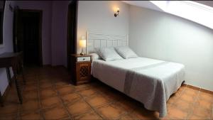 Postel nebo postele na pokoji v ubytování Hostal Santiago