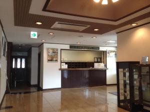 a lobby of a restaurant with a bar in it at Hotel Petit Riviere Karuizawa in Karuizawa