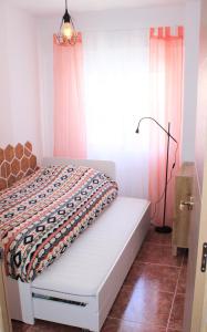 Posteľ alebo postele v izbe v ubytovaní Miralmar Apartamento