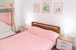 Posteľ alebo postele v izbe v ubytovaní Miralmar Apartamento